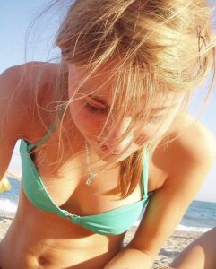 Blonde Cutie At The Beach